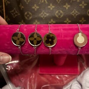 Choose a bracelet.  Upcycled from purse Made with silver colored jewelry/resin